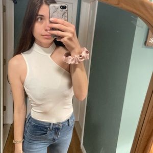 Super cute white bodysuit with shoulder cutout from Forever 21.